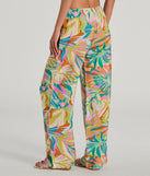The Getaway Retreat High Rise Tropical Pants in multi-color is a versatile pair of women's pants with trendy design accents, crafted for celebration-ready looks, from office wear to sophisticated winter night outs.