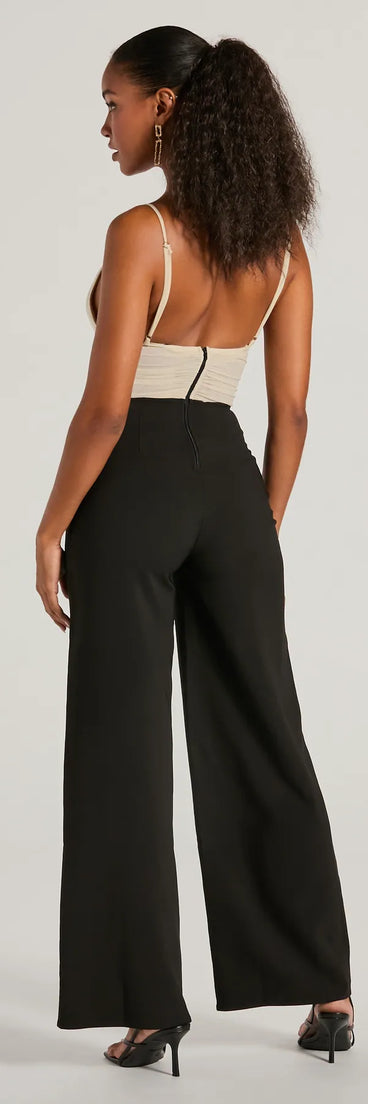 The Sweet And Chic Bow Detail Sleeveless Jumpsuit is a trendy women's bottom in black, designed with modern details and alluring textures to complete chic outfits for 2025.