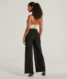 The Sweet And Chic Bow Detail Sleeveless Jumpsuit is a trendy women's bottom in black, designed with modern details and alluring textures to complete chic outfits for 2025.