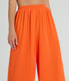 Step into seasonal style with the Gorgeous Allure Chiffon Palazzo Pants, a pair of women's orange pants in a rich winter color, ideal for creating chic holiday party attire or a night-out look.