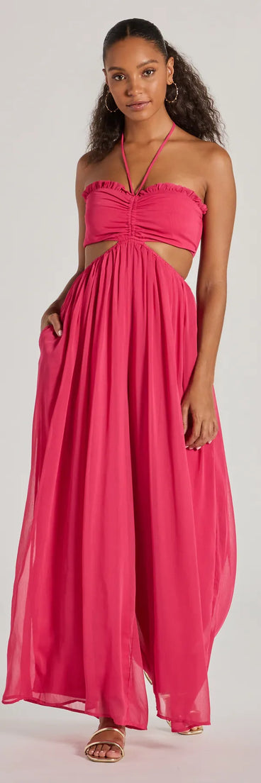 The Ready To Charm Halter Cutout Wide-Leg Jumpsuit in fuchsia is a women's jumpsuit with an on-trend leg style and elevated fabric that adds texture, perfect for crafting effortless winter outfits.