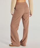 The Casually Sleek Woven Trouser Pants is a trendy women's bottom in mocha brown, designed with modern details and alluring textures to complete chic outfits for 2025.