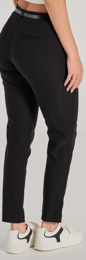 The Sleek Perfection High-Rise Belted Skinny Pants is a trendy women's bottom in black, designed with modern details and alluring textures to complete chic outfits for 2025.