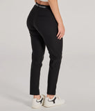 The Sleek Perfection High-Rise Belted Skinny Pants is a trendy women's bottom in black, designed with modern details and alluring textures to complete chic outfits for 2025.