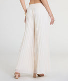 Create bold, fashion-forward looks for spring or summer with the Pretty Pleats High-Rise Chiffon Palazzo Pants in natural, a must-have piece from Windsor’s collection of stylish bottoms for women.