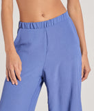 Create bold, fashion-forward looks for spring or summer with the Airy Chic Woven Wide-Leg Pants in denim blue, a must-have piece from Windsor’s collection of stylish bottoms for women.