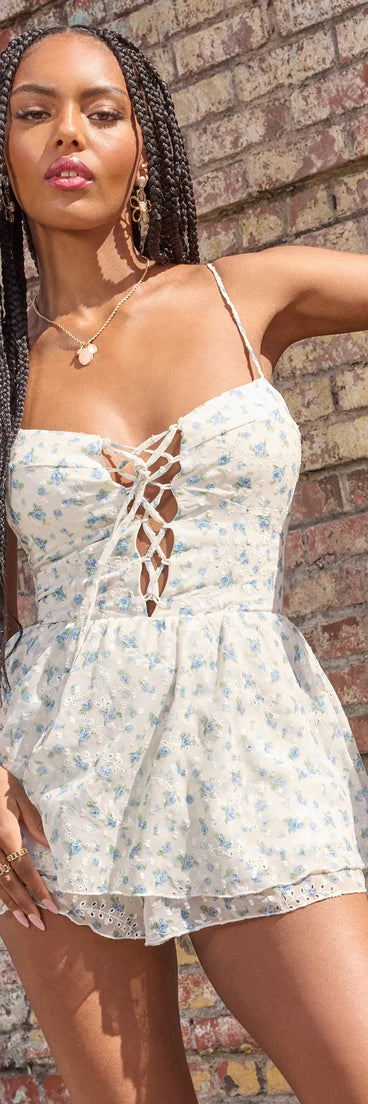 Soak up the season in the Sunny Muse Floral Eyelet Chiffon Romper, a ivory sundress styled for easy days, outdoor plans, and everything in between.