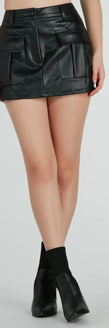 With the convenience of shorts and the look of a skirt, the Edgy Behavior Faux Leather Cargo Skort in black is a must-have for fashionable winter layers and versatile holiday styling.