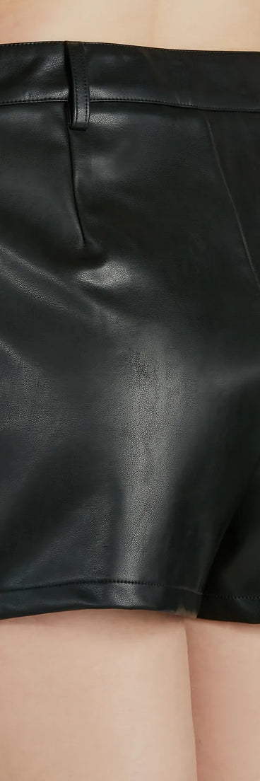 The Edgy Behavior Faux Leather Cargo Skort offers a discreetly comfy fit with shorts under a stylish skirt overlay featuring the latest accents and details.