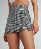The Girl Next Door Gingham Print Mini Skort offers a discreetly comfy fit with shorts under a stylish skirt overlay featuring the latest accents and details.