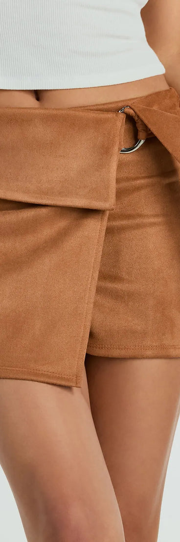 The Going Everywhere Belted Faux Suede Skort is a trendy women's bottom in camel brown, designed with modern details and alluring textures to complete chic outfits for 2025.
