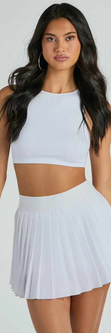 The Set And Match Pleated Tennis Skort in off-white brings edge and energy to your vibe, ready to elevate any festival look or concert outfit.