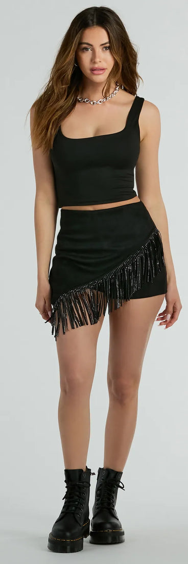 The Shake It Out Rhinestone Fringe Faux Suede Skort offers a discreetly comfy fit with shorts under a stylish skirt overlay featuring the latest accents and details.