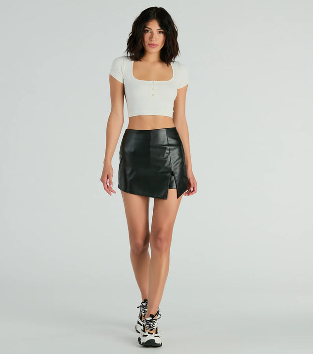 The Born To Be Sleek High-Rise Slit Faux Leather Skort in black brings edge and energy to your vibe, ready to elevate any festival look or concert outfit.