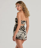 Perfect as a dress alternative for a New Year's outfit, wedding guest attire, and cocktail party dress alike, the Exotic Vibes Strapless Tie-Front Tropical Romper is a women's black romper that combines a stylish, unique design with festive colors and holiday-ready details for a standout look!