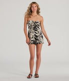 Perfect as a dress alternative for a New Year's outfit, wedding guest attire, and cocktail party dress alike, the Exotic Vibes Strapless Tie-Front Tropical Romper is a women's black romper that combines a stylish, unique design with festive colors and holiday-ready details for a standout look!