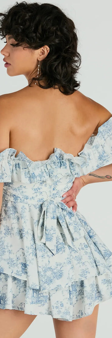 The Pretty Girl Ruffled Off-The-Shoulder Scenic Print Romper is an elevated one-piece that blends sleek sophistication with playful charm, perfect for nailing casual or formal outfits.