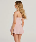 Perfect as a dress alternative for a New Year's outfit, wedding guest attire, and cocktail party dress alike, the Irresistible Cutie Lace-Up Skater Romper is a women's mauve romper that combines a stylish, unique design with festive colors and holiday-ready details for a standout look!