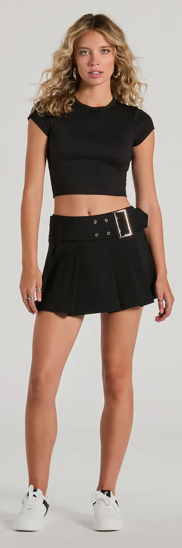 The Get Compliments High-Rise Belted Pleated Skort is a trendy women's bottom in black, designed with modern details and alluring textures to complete chic outfits for 2025.