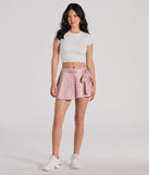Step out in the Releve Cutie Faux Wrap Satin Skater Skirt, a sleek mauve short made to pair with summer tops and create scroll-stopping going-out looks.