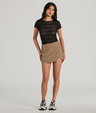 The Perfect Delight High Rise Scallop Wrap Mini Skort in taupe is a women's workwear essential with an elevated fabric and chic silhouette, ideal for layering and versatile enough to take your look from office chic to going-out ready!