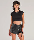 The Sultry Edge Lace-Up Faux Leather Skort is a trendy women's bottom in black, designed with modern details and alluring textures to complete chic outfits for 2025.