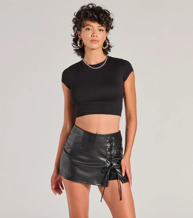 The Sultry Edge Lace-Up Faux Leather Skort is a trendy women's bottom in black, designed with modern details and alluring textures to complete chic outfits for 2025.