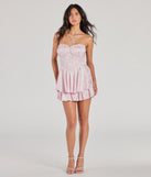 The Gorgeous Stance Strapless Corset Floral Satin Romper is a blush dress, an essential holiday or NYE dress that pairs chic style with versatility making it perfect for cocktail events, New Year's Eve parties, or as a winter wedding guest look.