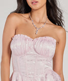 The Gorgeous Stance Strapless Corset Floral Satin Romper is a blush dress, an essential holiday or NYE dress that pairs chic style with versatility making it perfect for cocktail events, New Year's Eve parties, or as a winter wedding guest look.