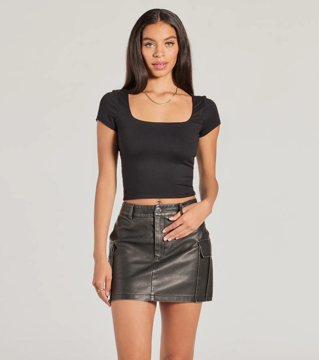 The Edgy Cuteness High Rise Cargo Faux Leather Mini Skort offers a discreetly comfy fit with shorts under a stylish skirt overlay featuring the latest accents and details.