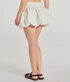 With a flirty cut and hidden shorts underneath, the Darling Allure Drop Waist Bubble Hem Woven Skort in ivory serves skirt vibes with zero wardrobe worries.