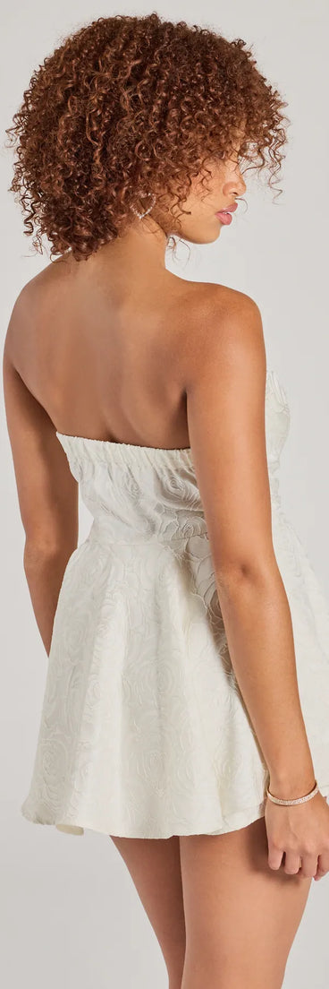 The Angelic Looks Strapless Floral Satin Romper is a trendy women's bottom in ivory, designed with modern details and alluring textures to complete chic outfits for 2025.