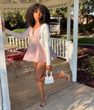 The Enchanting Chic Floral Jacquard Skater Romper is a mauve dress, an essential holiday or NYE dress that pairs chic style with versatility making it perfect for cocktail events, New Year's Eve parties, or as a winter wedding guest look.