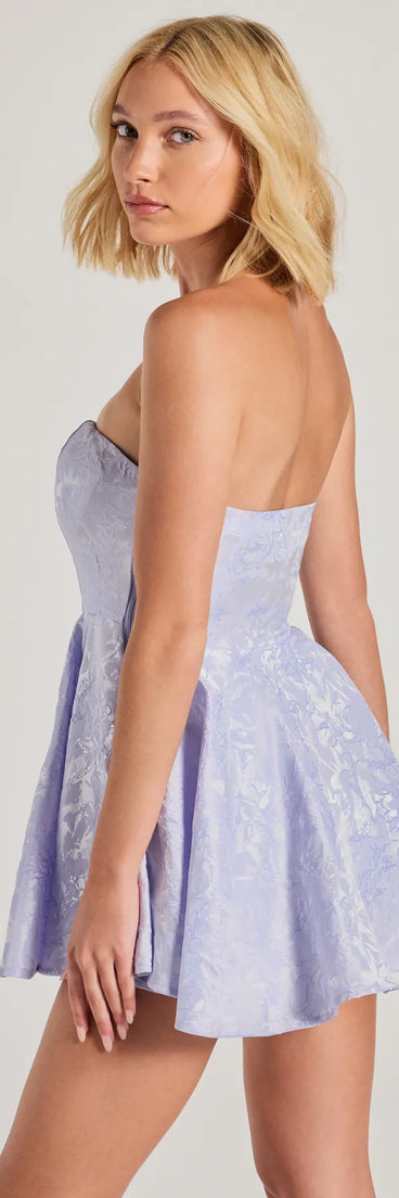 Step into the Prom 2025 dance in the Bring The Glamour Strapless Skater Romper, a stunning blue prom dress designed to complement any theme with its timeless allure and statement-making style.
