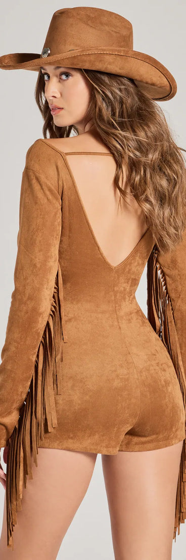 Back view of brown Faux Suede Romper highlighting fringe accents, a slim fit, and cutout back.