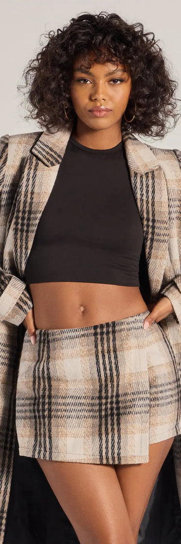 The Classic Charm Plaid Wrap Skort is a trendy women's bottom in gray, designed with modern details and alluring textures to complete chic outfits for 2025.