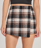 Create bold, fashion-forward looks for spring or summer with the Classically Chic Plaid High Waist Wrap Skort in black, a must-have piece from Windsor’s collection of stylish bottoms for women.