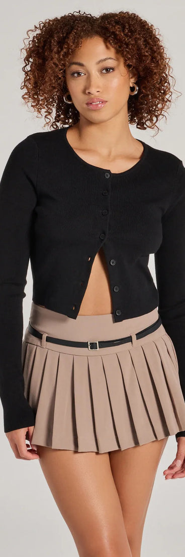 The Pleated Perfection Drop Waist Belted Skort in taupe is a women's workwear essential with an elevated fabric and chic silhouette, ideal for layering and versatile enough to take your look from office chic to going-out ready!