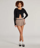 The Pleated Perfection Drop Waist Belted Skort in taupe is a women's workwear essential with an elevated fabric and chic silhouette, ideal for layering and versatile enough to take your look from office chic to going-out ready!