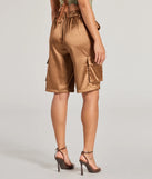 The Trendsetter Vibes Satin Cargo Jorts is a trendy women's bottom in brown, designed with modern details and alluring textures to complete chic outfits for 2025.