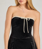 The Adorable Status Strapless Bow Trim Velvet Romper is a trendy women's bottom in black, designed with modern details and alluring textures to complete chic outfits for 2025.