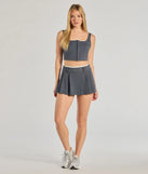 Effortlessly create party outfits or vacation-ready looks with the Keep It Casual Pleated Mini Skort, one part of a versatile women's charcoal matching set perfect for quick and easy outfit combinations from layering chic outfits to transitioning your look seamlessly.