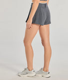 The Keep It Casual Pleated Mini Skort is a trendy women's bottom in charcoal, designed with modern details and alluring textures to complete chic outfits for 2025.