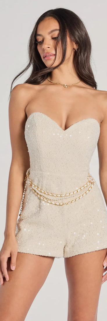The Polished Darling Tweed Sequin Belted Romper is a trendy women's bottom in ivory, designed with modern details and alluring textures to complete chic outfits for 2025.