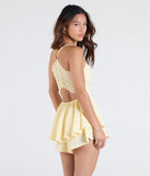 The Flirty Lace Back Skater Romper in yellow brings sleek style to any graduation outfit, from cap and gown to after-party.