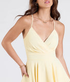 Create bold, fashion-forward looks for spring or summer with the Flirty Lace Back Skater Romper in yellow, a must-have piece from Windsor’s collection of stylish bottoms for women.