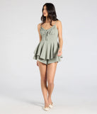 Create bold, fashion-forward looks for spring or summer with the Swept Away Tie-Back Ruffled Romper in sage green, a must-have piece from Windsor’s collection of stylish bottoms for women.