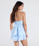 The Eternal Bliss Strapless Ruffled Romper in light blue brings sleek style to any graduation outfit, from cap and gown to after-party.