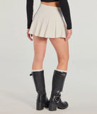 The Chic Mood Pleated Belted Skort is a trendy women's bottom in ivory, designed with modern details and alluring textures to complete chic outfits for 2025.