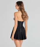 The Social Babe Belted Drop Waist Skater Romper is a trendy women's bottom in black, designed with modern details and alluring textures to complete chic outfits for 2025.